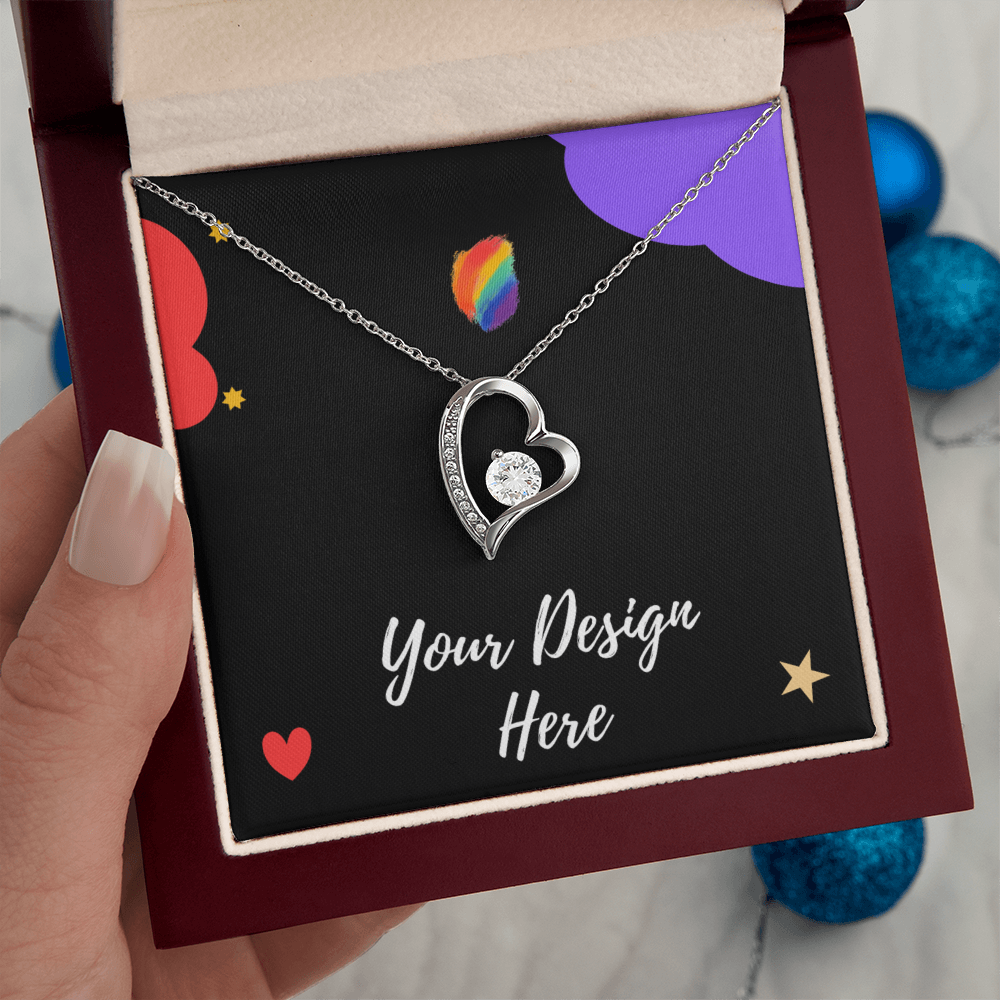 Silver heart-shaped pendant necklace with a central gemstone in a red velvet jewelry box