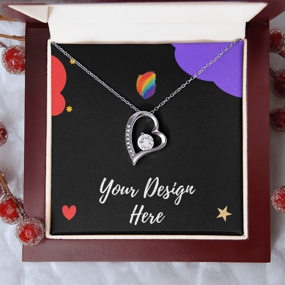 Silver heart-shaped pendant necklace with central gem in decorative gift box with Your Design Here text