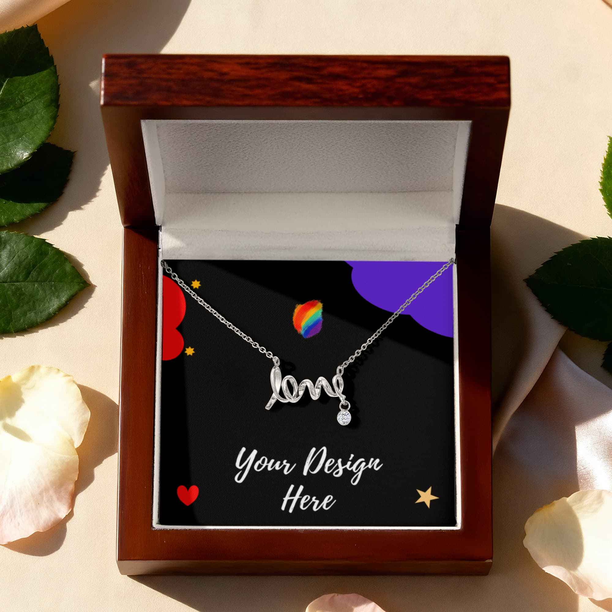 Silver necklace with 'love' pendant and small gem in wooden jewelry box with floral background