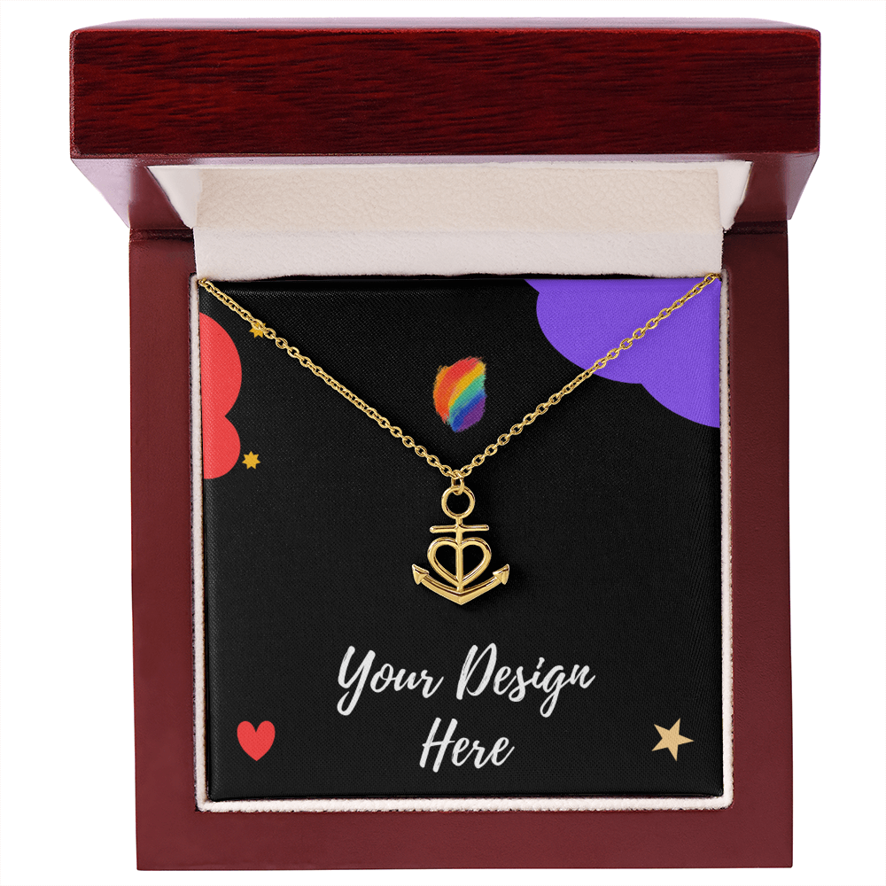 Gold anchor heart necklace in red wooden jewelry box with black card and colorful designs