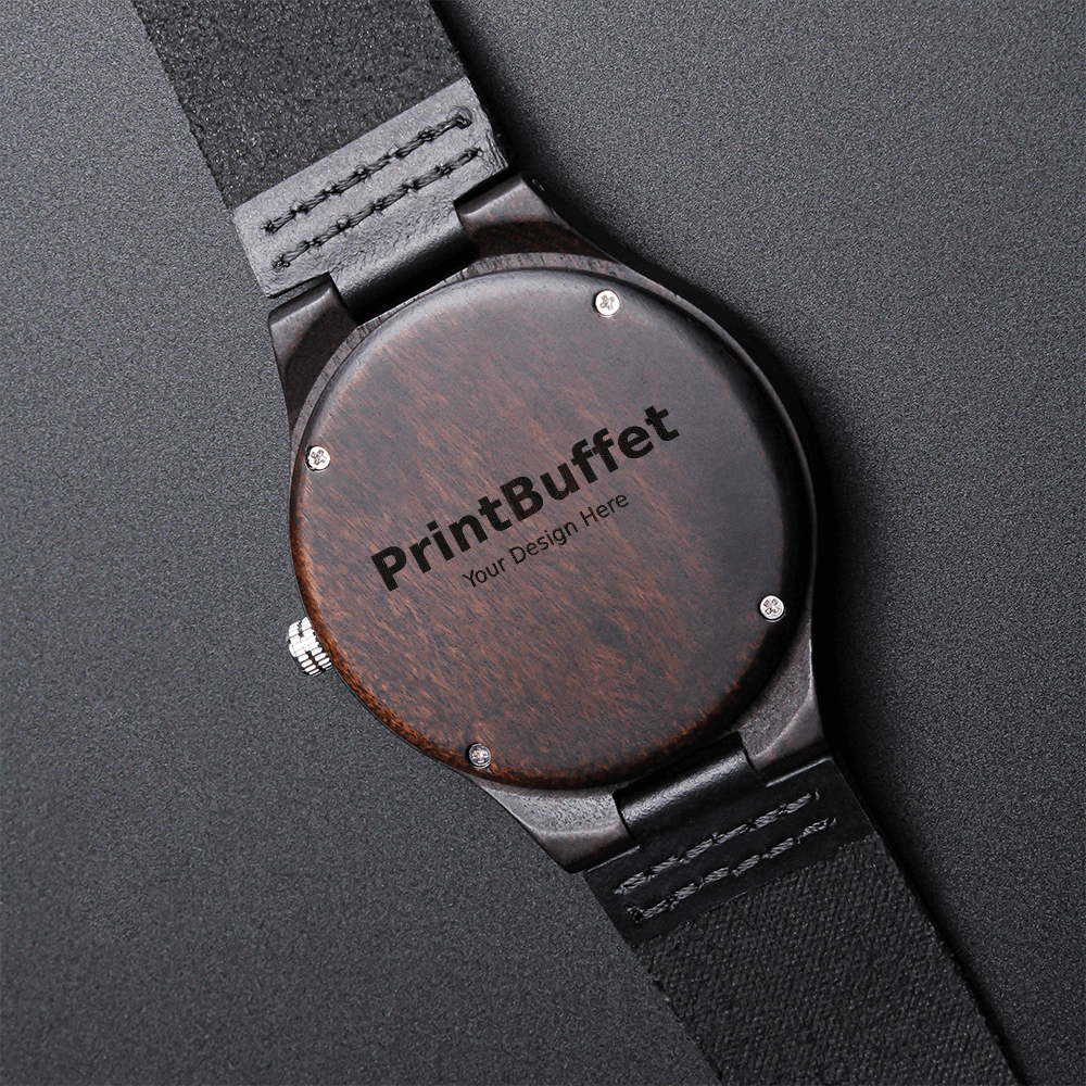 Back view of wooden wristwatch with black leather strap and PrintBuffet logo engraving