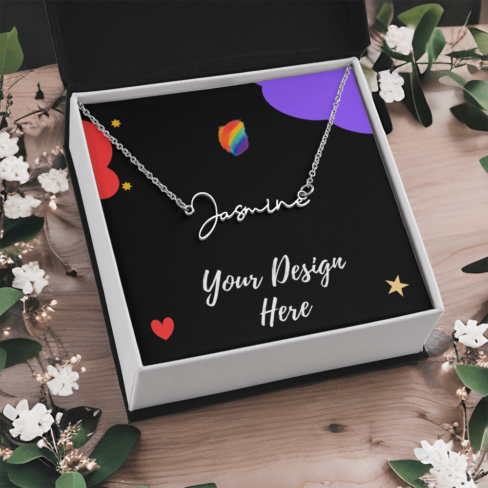 Silver name necklace with 'Jasmine' in script, displayed in open black and white box with floral decor