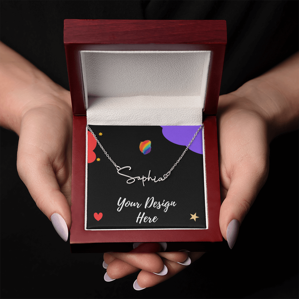 Hands holding an open red jewelry box with a silver name necklace reading Sophia on a black card