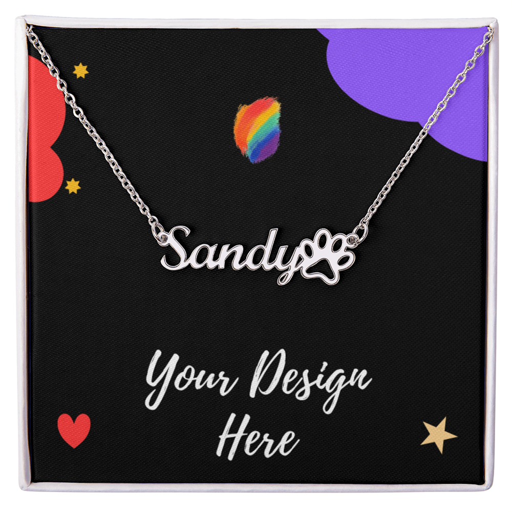 Silver name necklace with 'Sandy' and paw print on black box with rainbow and heart accents