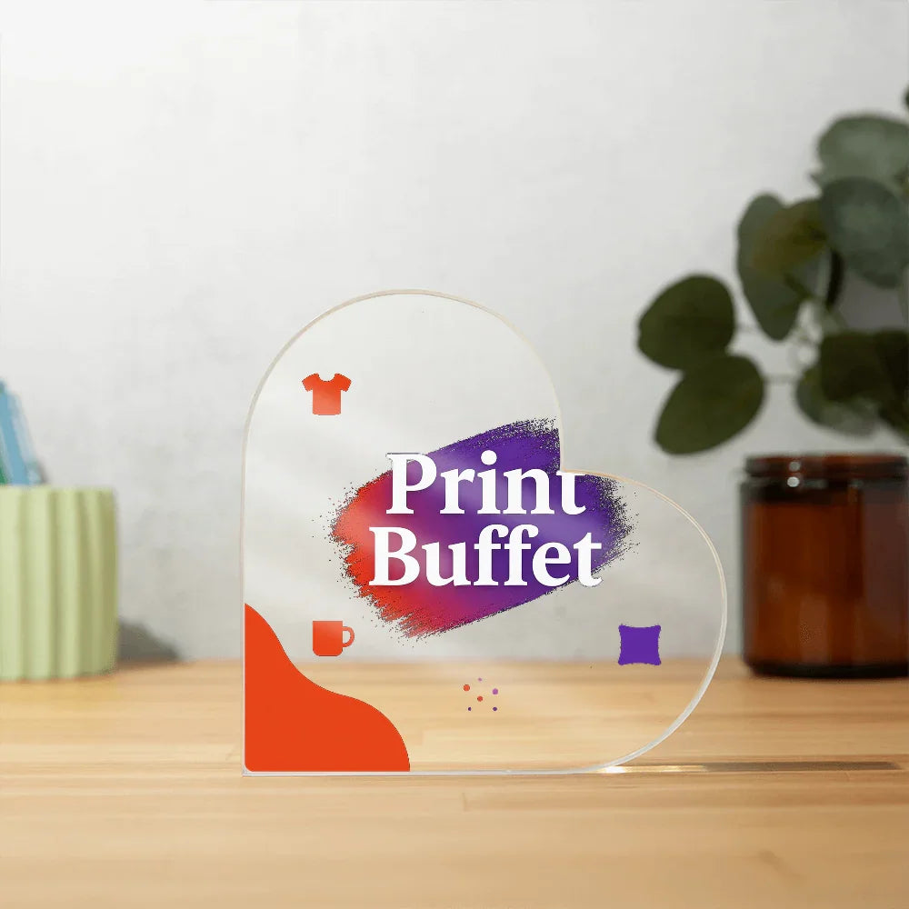 Heart-shaped acrylic sign on wooden table with Print Buffet logo and colorful print icons