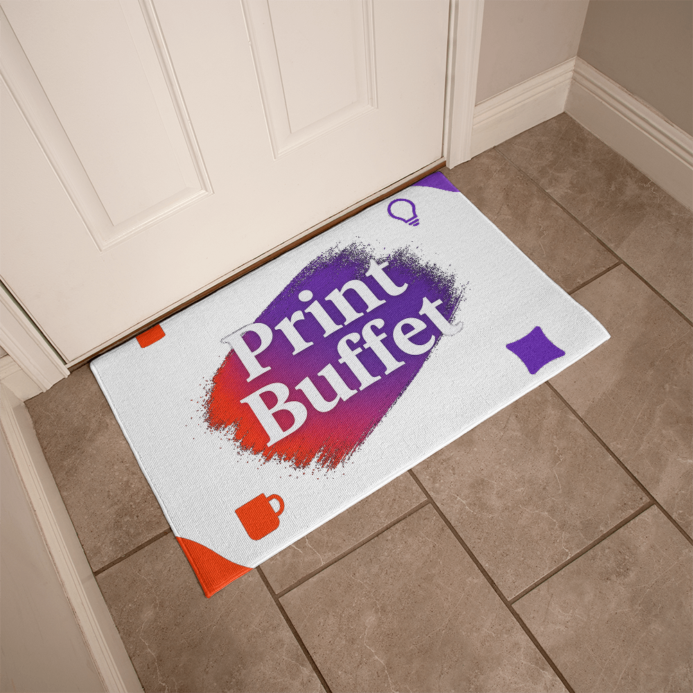 Doormat with colorful Print Buffet logo placed on tiled floor by a white door