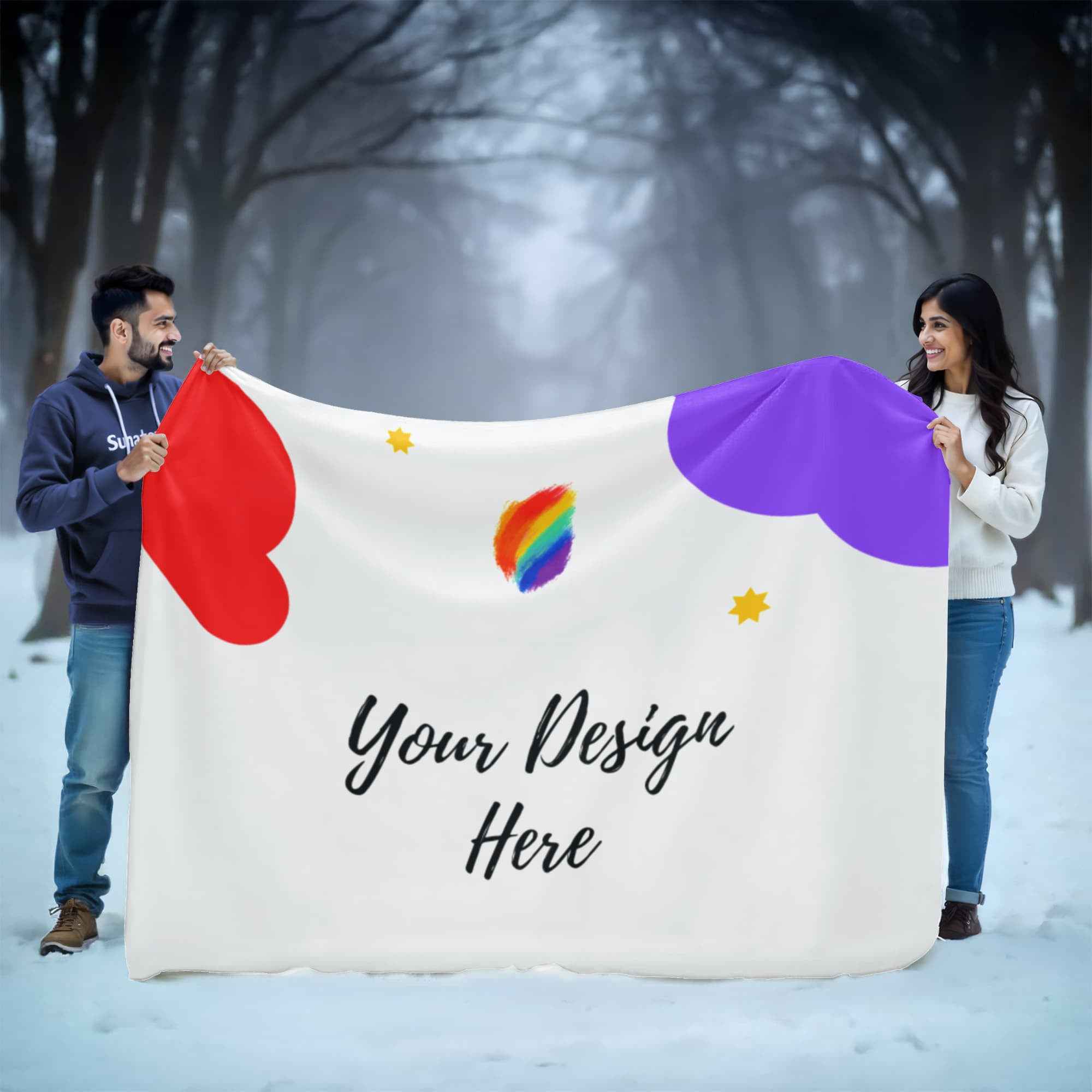 Man and woman holding customizable white blanket with colorful hearts and rainbow design in snowy forest