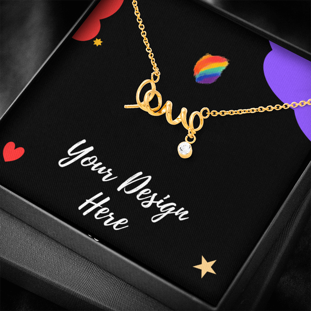 Gold script word love necklace with crystal pendant on black card with colorful hearts and rainbow design