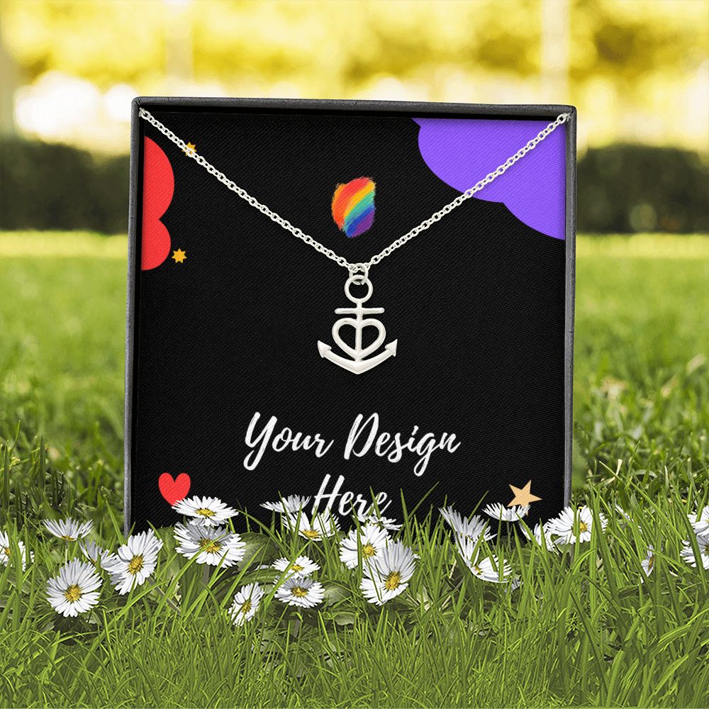 Silver anchor heart necklace in black box with flowers, grass, and vibrant background
