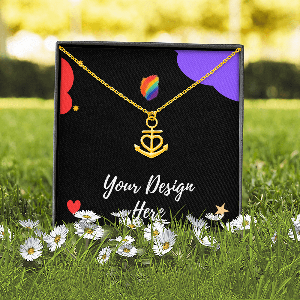 Gold anchor heart necklace on black display box with colorful shapes and daisies in grass