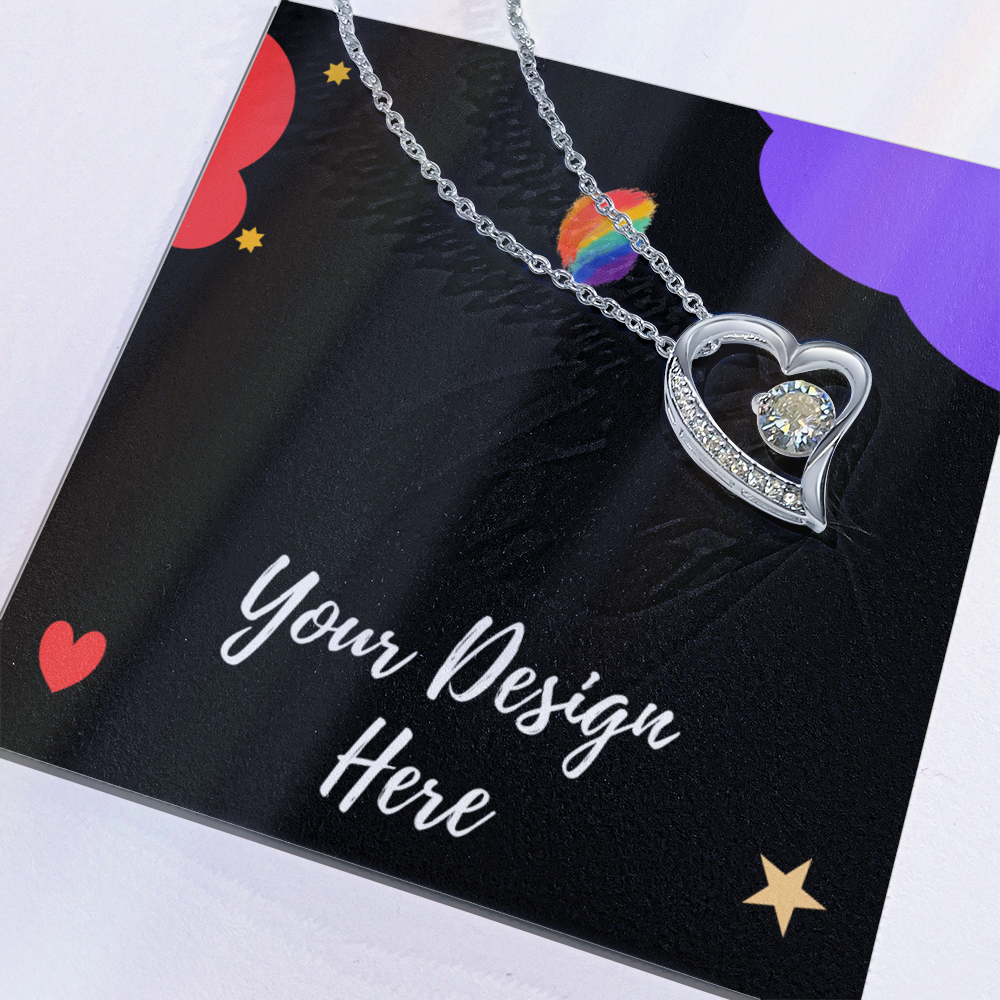 Silver heart-shaped pendant necklace with sparkling stones on black card with colorful design