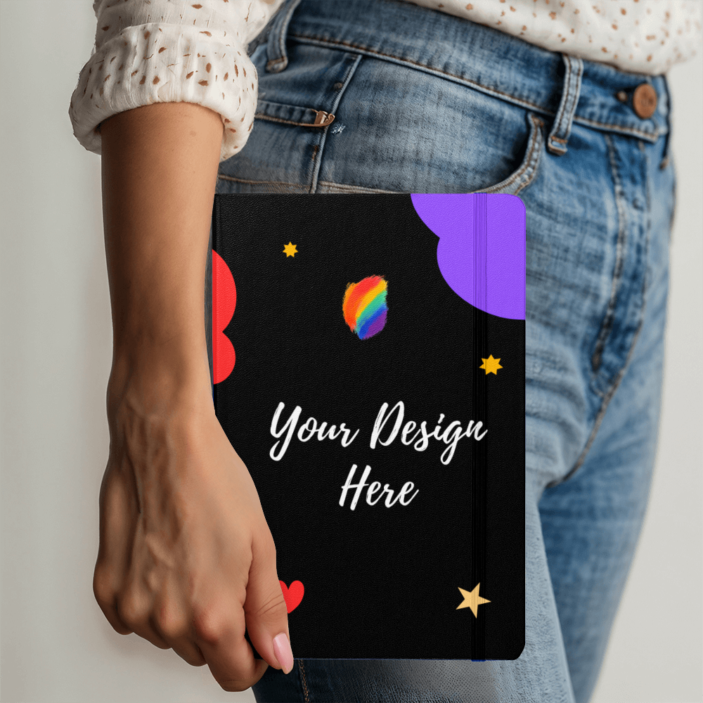Woman holding black notebook with colorful cloud and star design and Your Design Here text