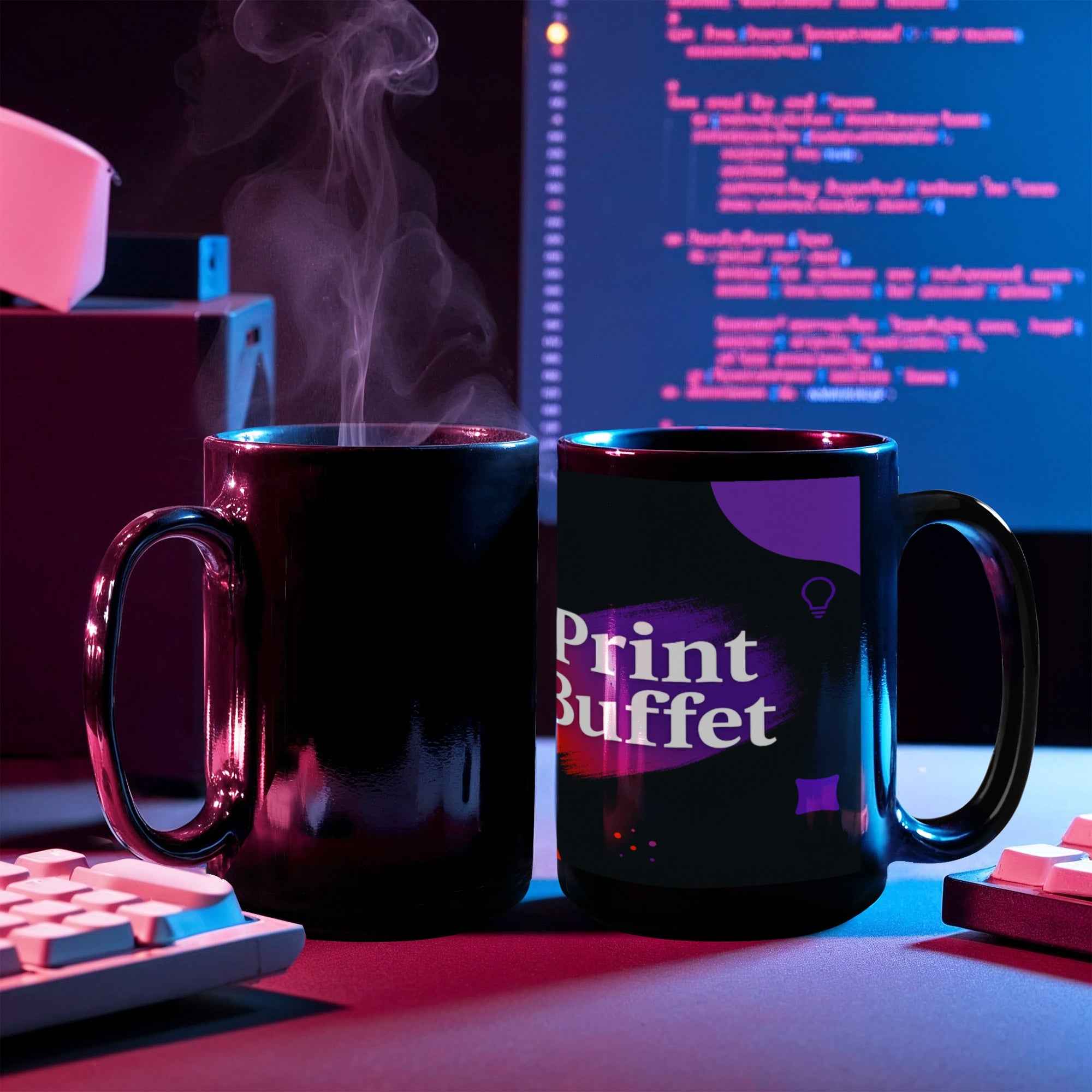Two black coffee mugs on a desk with one steaming and another printed with Print Buffet logo, computer code in background