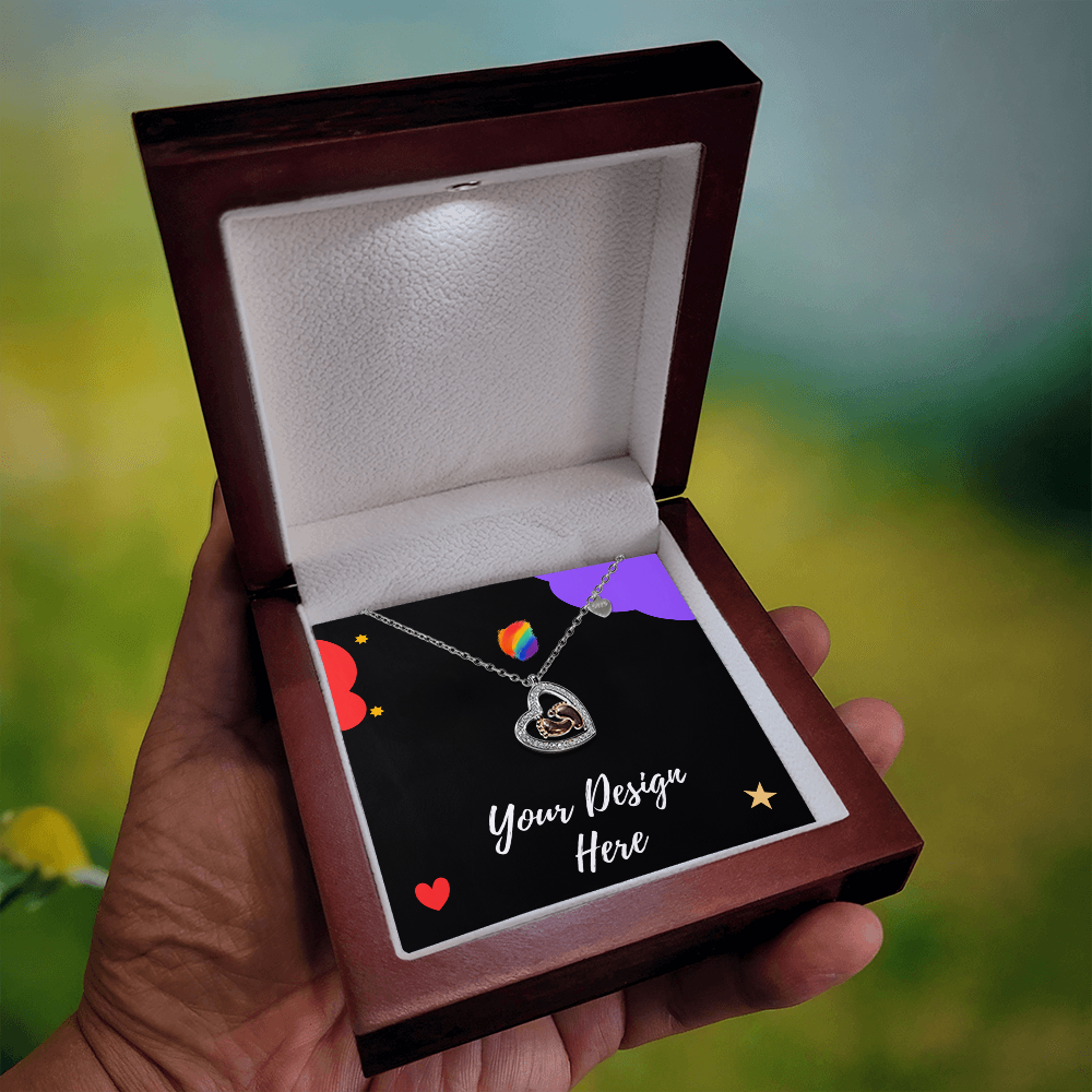 Hand holding open wooden jewelry box with heart-shaped pendant necklace and customizable card