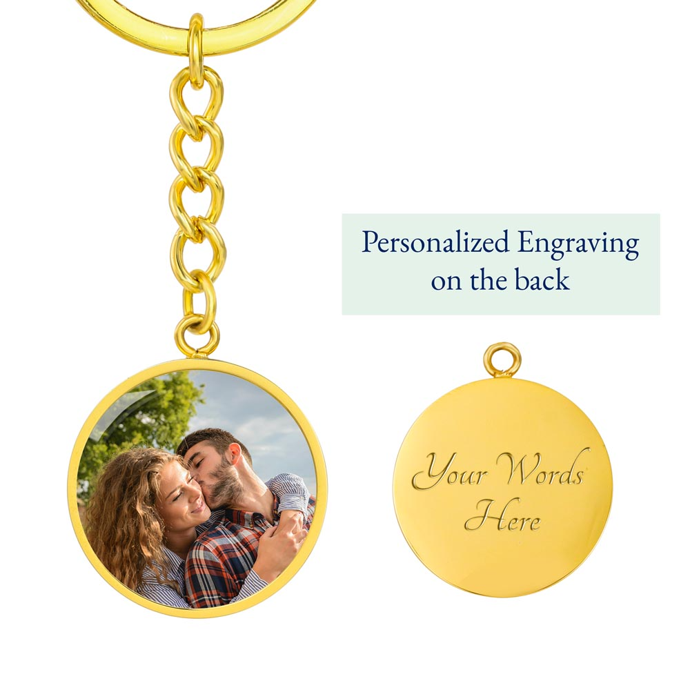 Gold photo keychain featuring a couple embracing and customizable engraving on the back